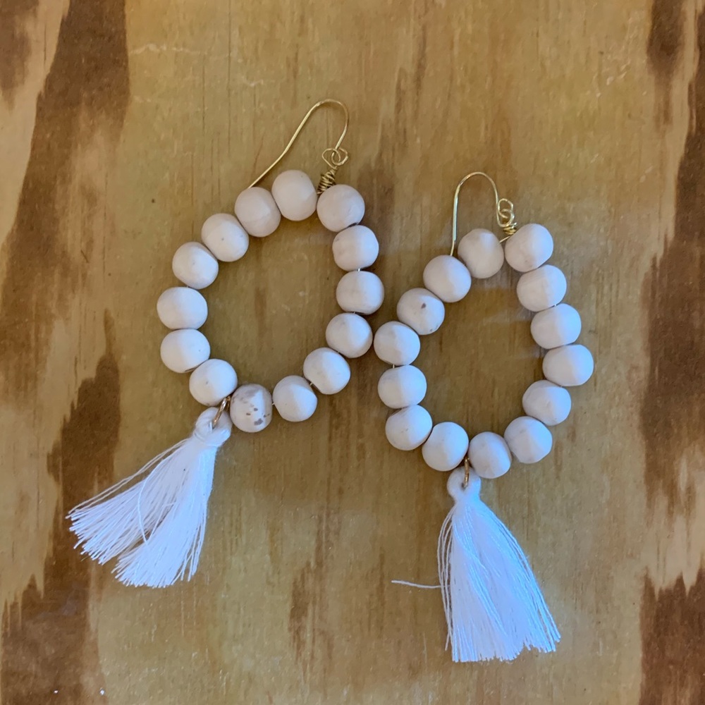 Hand made wood ball with white fringe